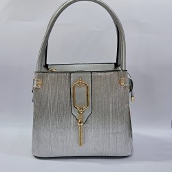 Label püsküllü simli kumaş kadın kol çantası gümüş