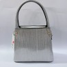 Label püsküllü simli kumaş kadın kol çantası gümüş